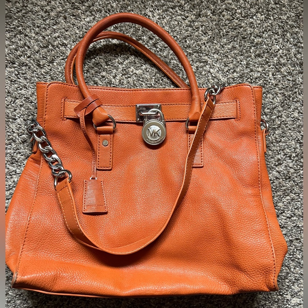Burnt orange Michael kors leather bag with silver hardware